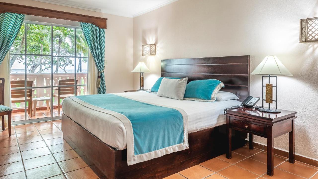 บี ลีฟ คอลเลคชั่น มาเรียน - ออล อินคลูซีฟ Hotel Puerto Plata ห้อง รูปภาพ A bedroom at the hotel